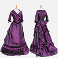 Purple satin Victorian sissy maid dress front and back view with ruffle trim, corset bodice, apron panel, long sleeves and dramatic full skirt custom made