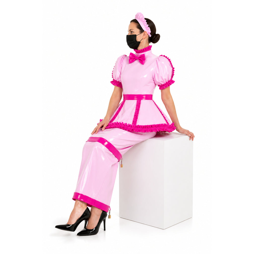 Pink sissy maid dress with ruffles, bow, and lockable design, paired with black heels