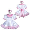 White and pink sissy maid dress with lace trim, puff sleeves, and matching headband, displayed on mannequins