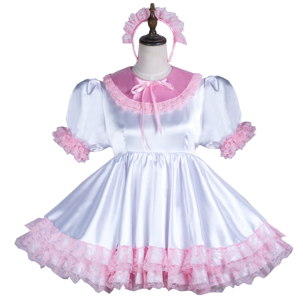Pink and white sissy maid dress with lace trim, puffed sleeves, and matching headband on mannequin