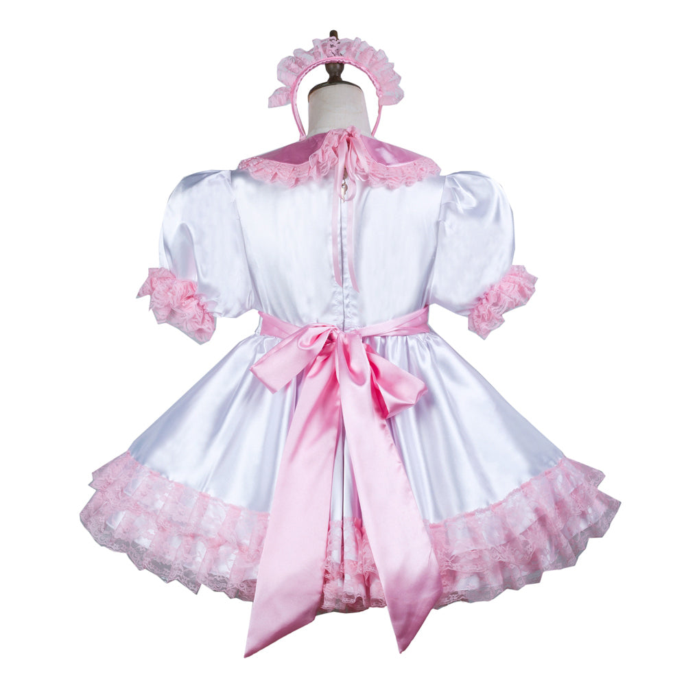 Pink and white sissy maid dress with lace trim, satin bow, and matching headband on mannequin