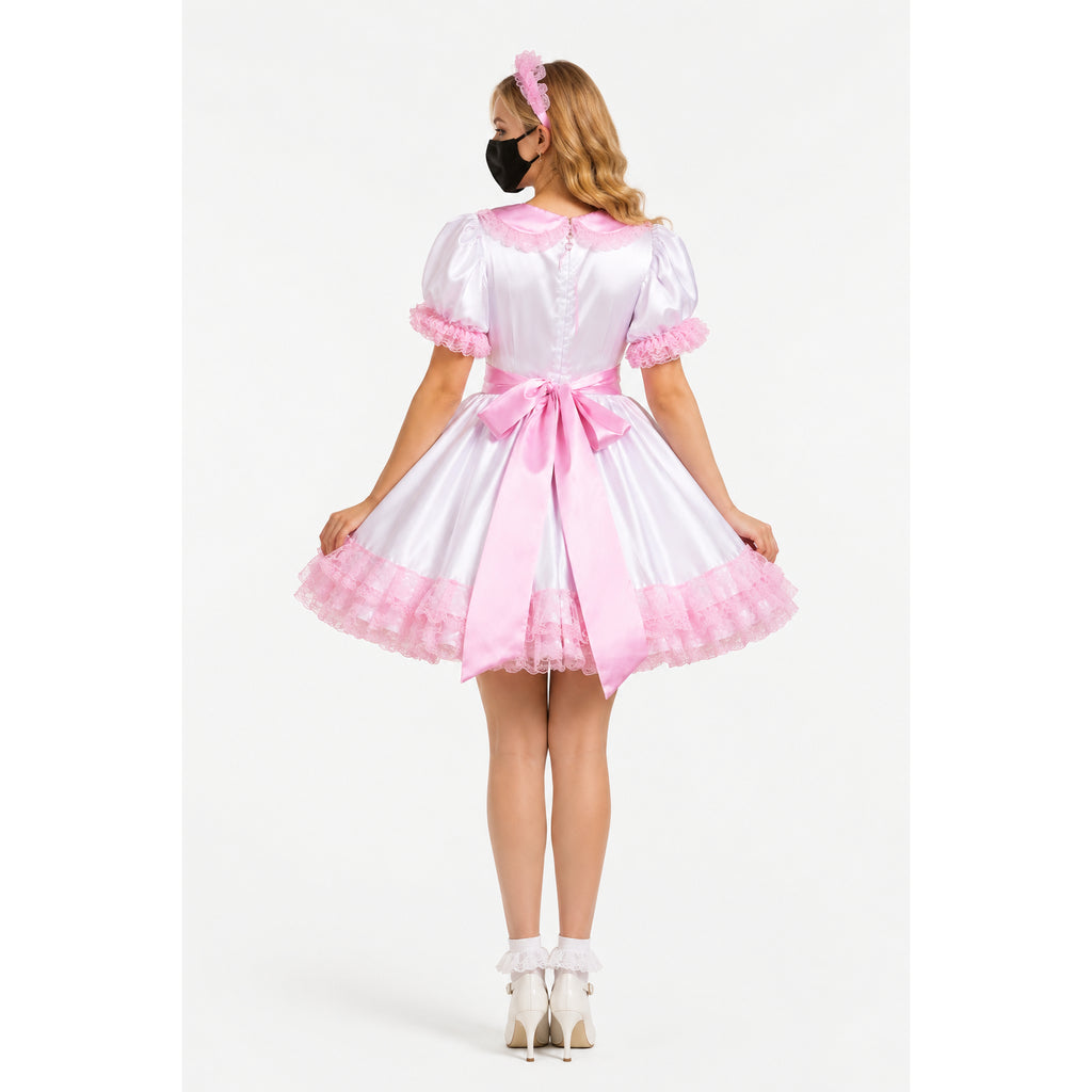 Pink and white sissy maid dress with ruffles, bow, and matching headband, shown from back