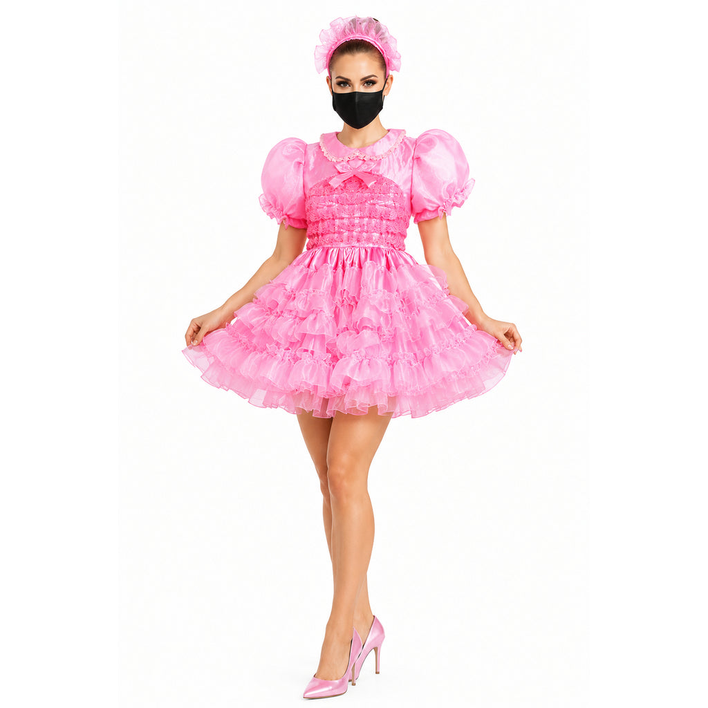 Pink sissy maid dress with ruffles, puff sleeves, and matching headband, styled with heels