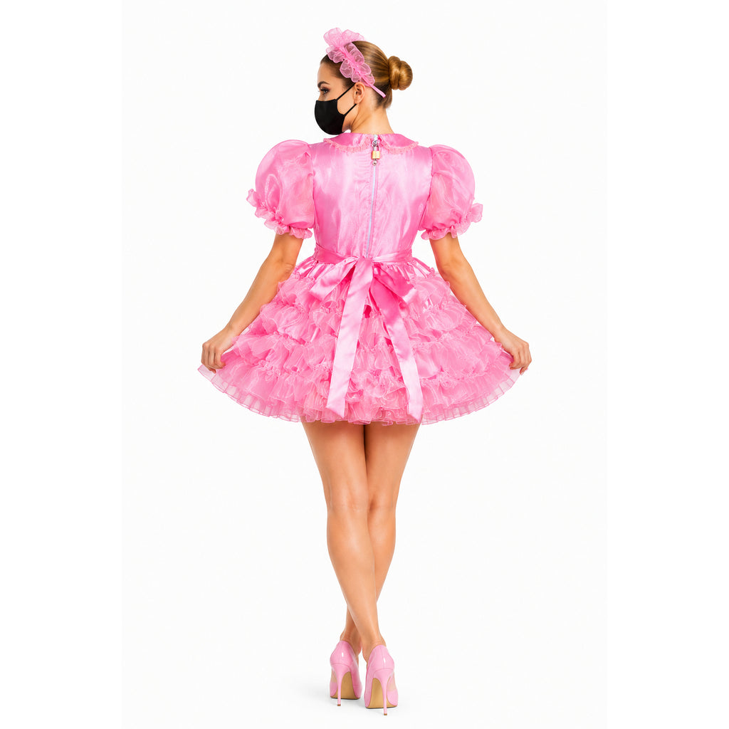 Pink sissy maid dress with ruffles, puff sleeves, and back zipper, paired with matching heels and headband