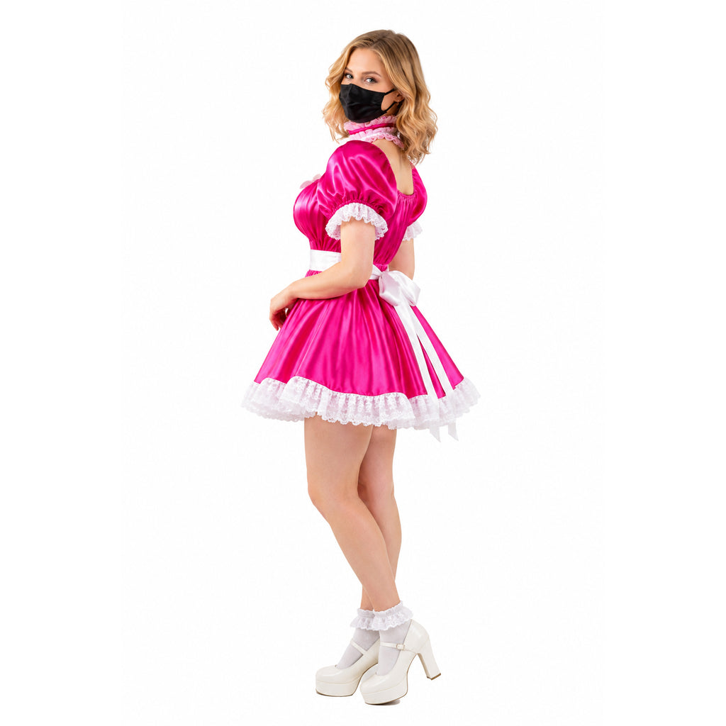 Pink sissy maid dress with white lace trim, bow, and platform heels
