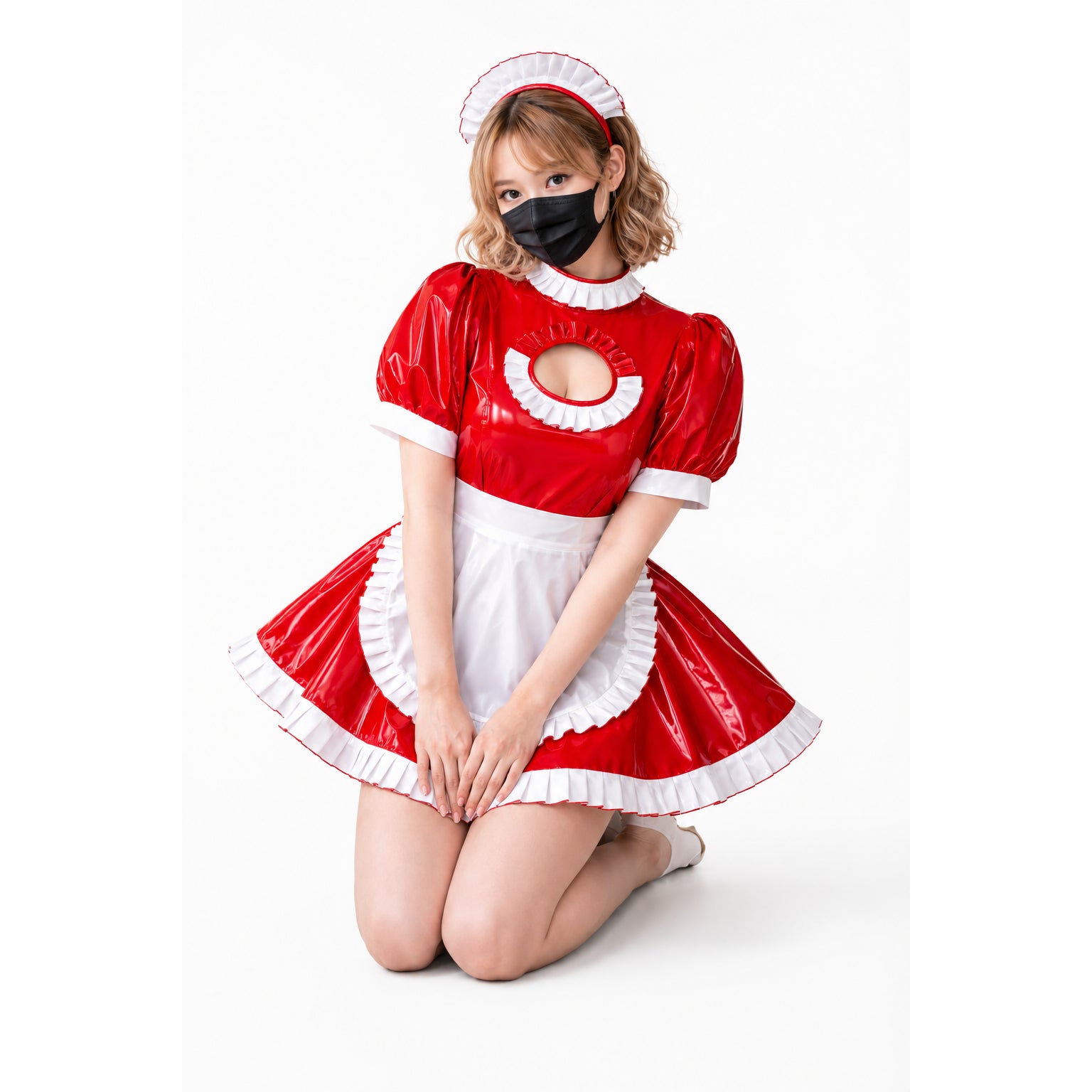 Red PVC sissy maid dress with white frills, chest cutout, and matching headband, worn by kneeling model.