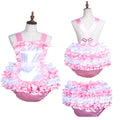 Pink and white ruffled sissy maid dress set with satin bows and layered skirt on mannequin