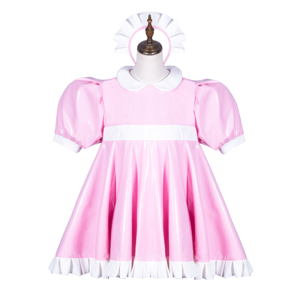 Pink sissy maid dress with white trim, puffed sleeves, and matching headpiece on mannequin