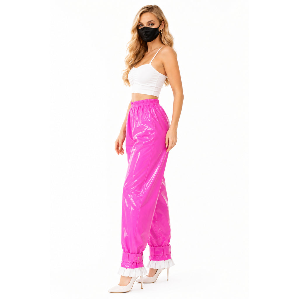 Pink PVC sissy maid pants with ruffles, paired with white crop top and heels