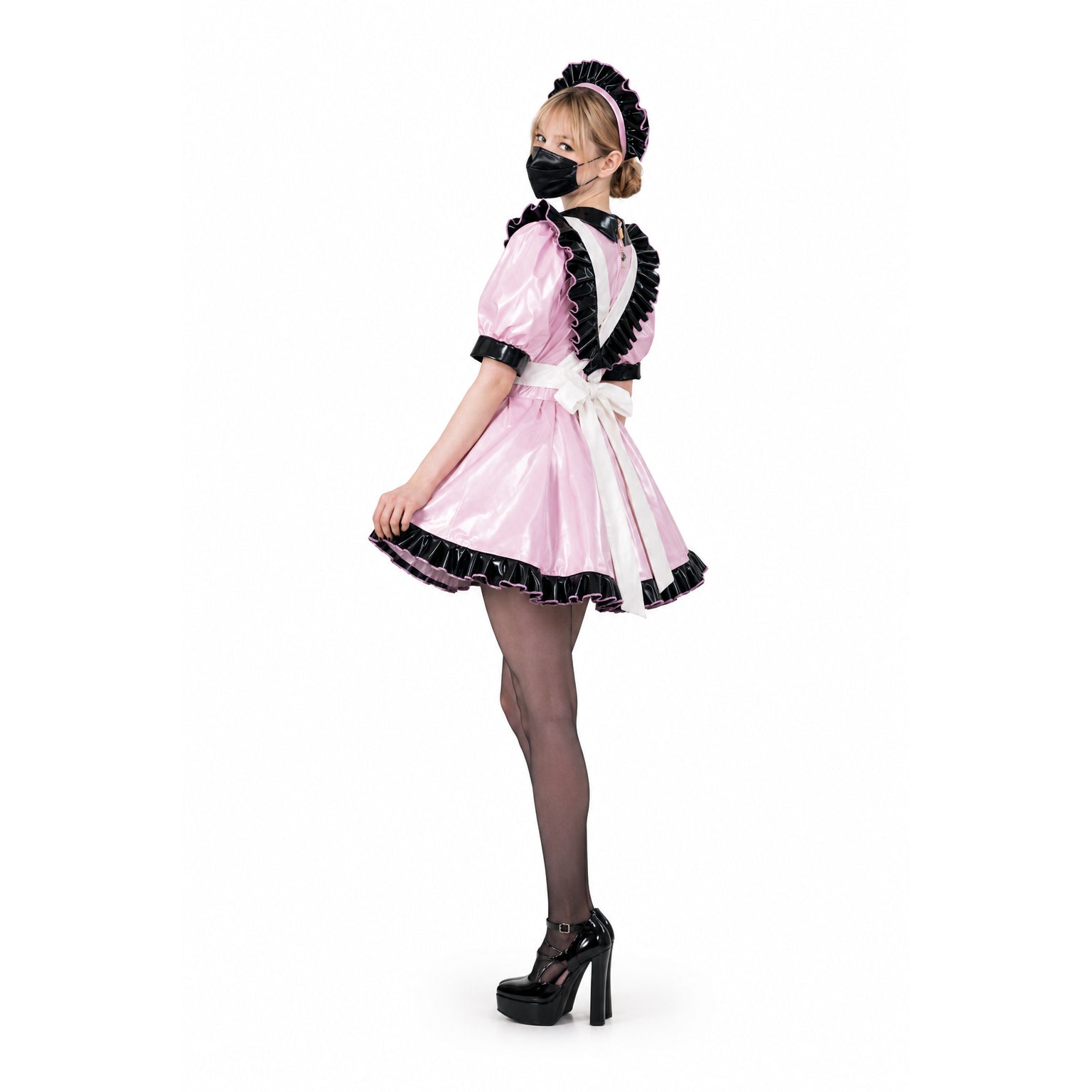Pink sissy maid dress with black ruffles, white apron, and PVC details, styled with heels and mask