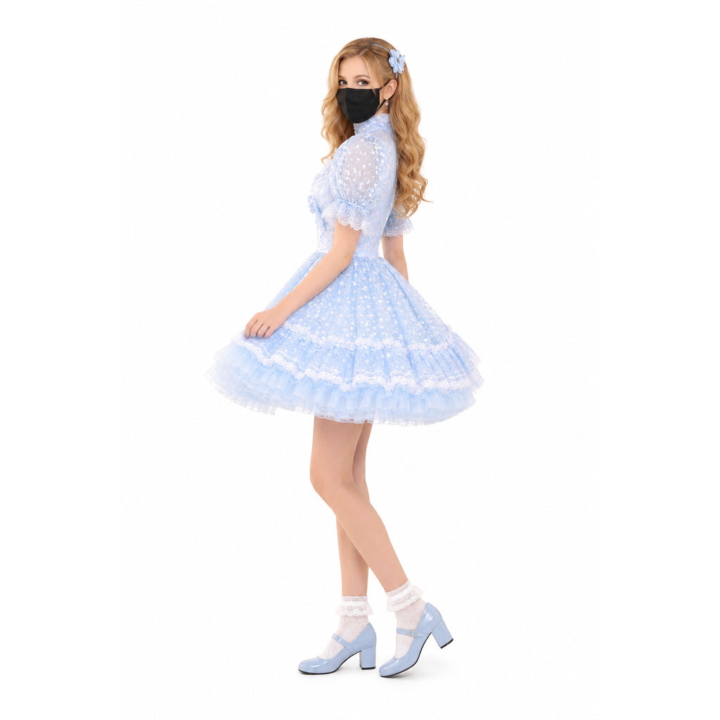 Light blue sissy maid dress with lace trim, puffed sleeves, and tiered tulle skirt, paired with matching heels.