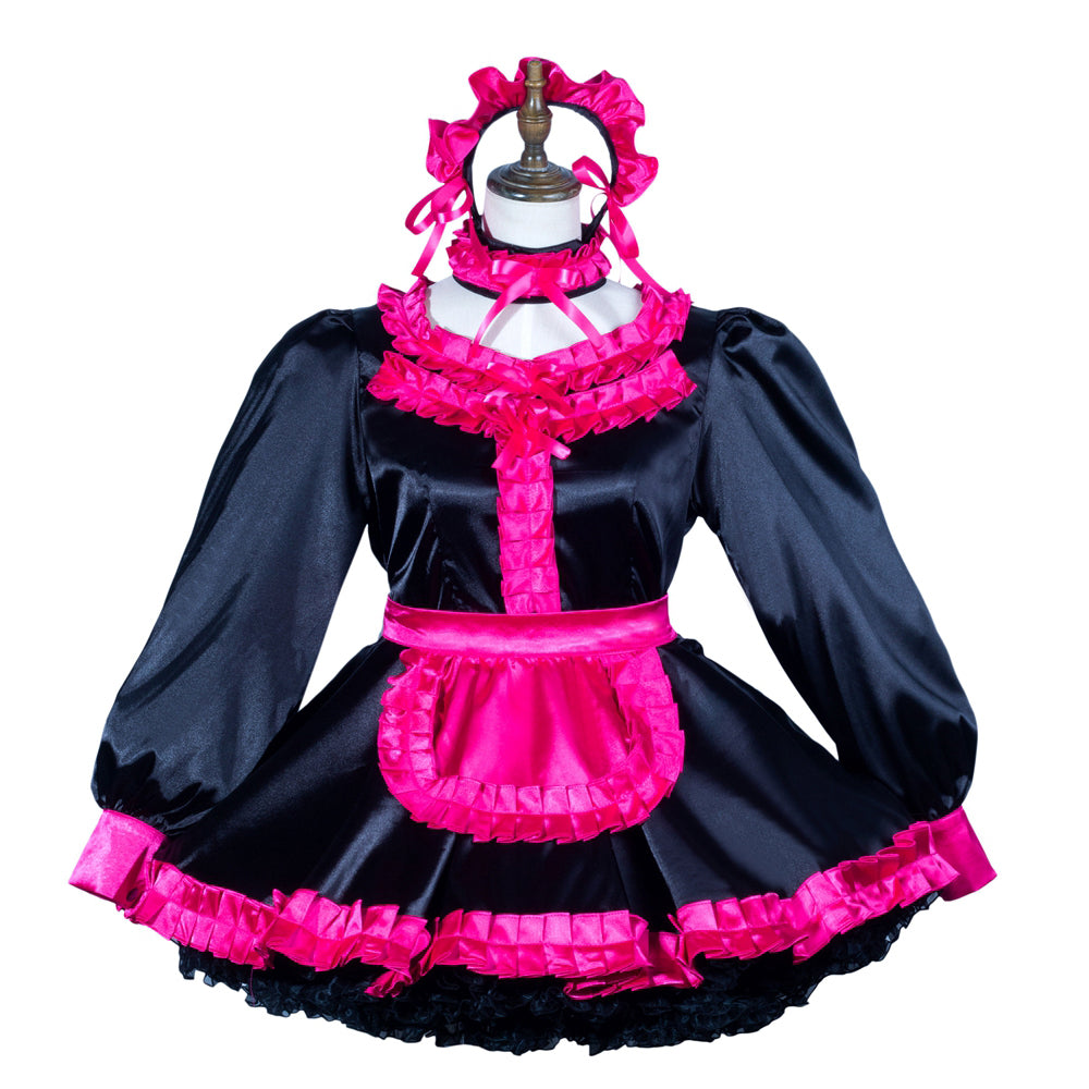 Black and hot pink sissy maid dress with ruffles, apron, and matching headpiece on mannequin