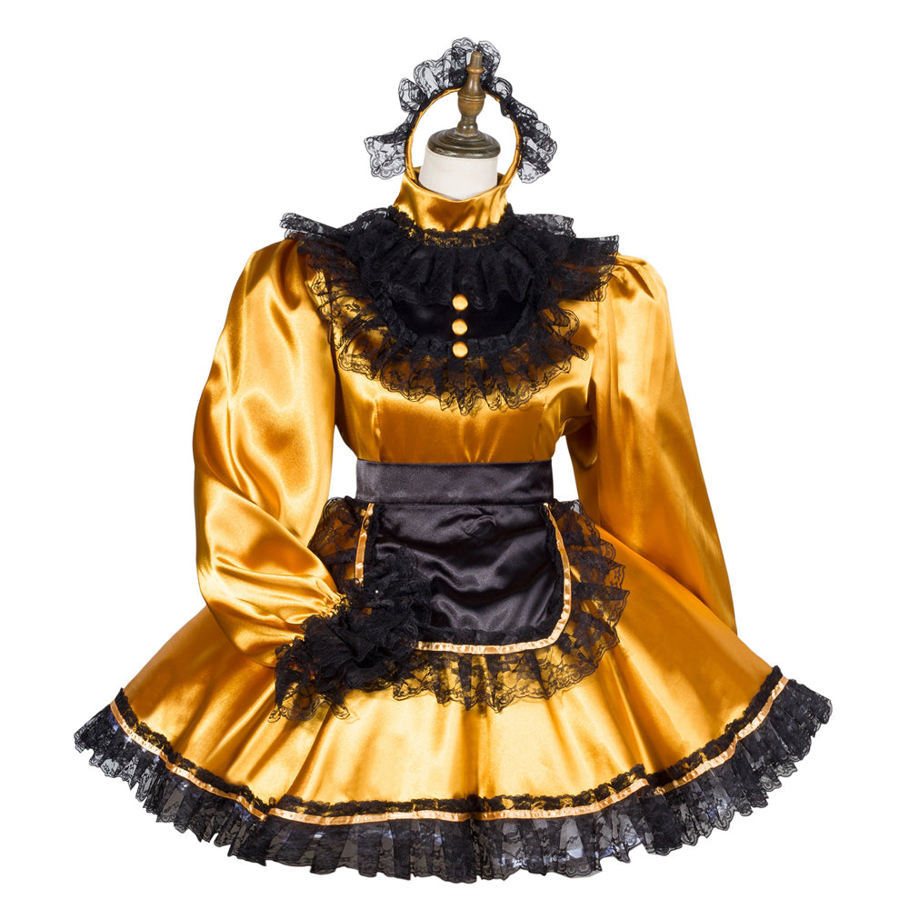 Golden sissy maid dress with black lace trim, ruffled collar, and matching headpiece on mannequin