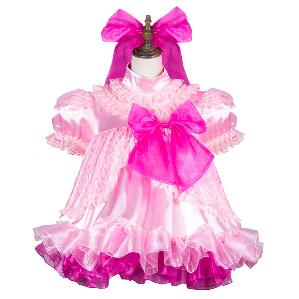 Pink sissy maid dress with ruffles, lace, and large bow on mannequin