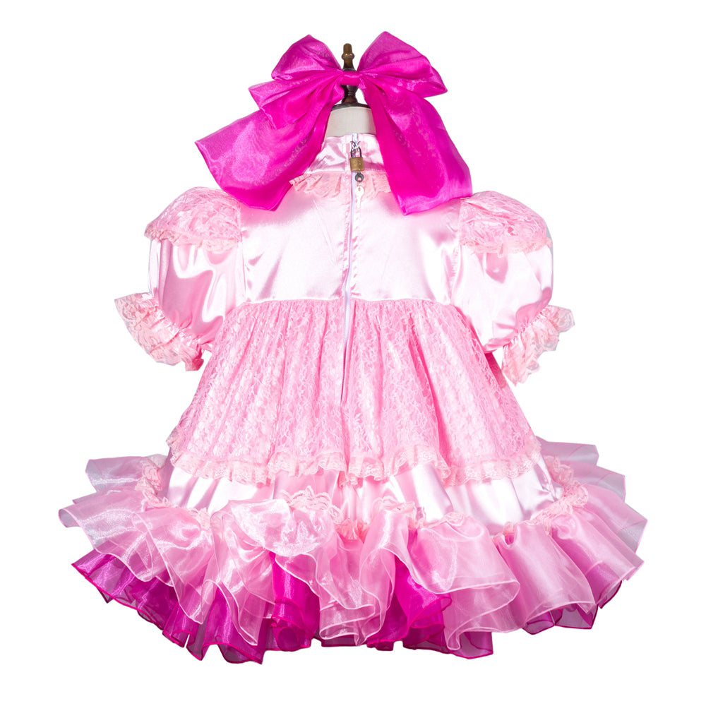 Pink sissy maid dress with lace, ruffles, and large bow, featuring satin and taffeta layers for elegant costume fashion.