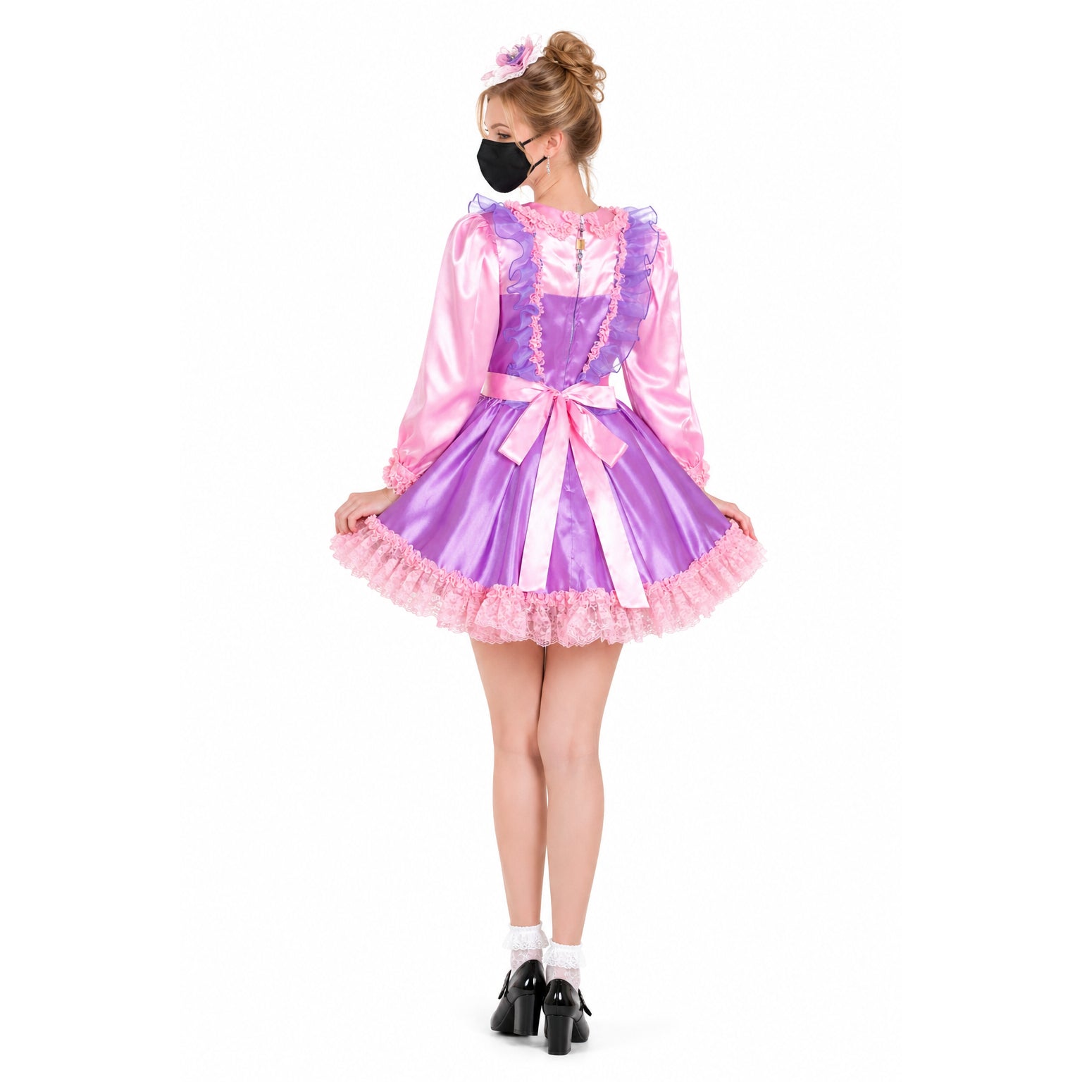Pink and purple sissy maid dress with ruffles, bow, and satin finish, shown from back view