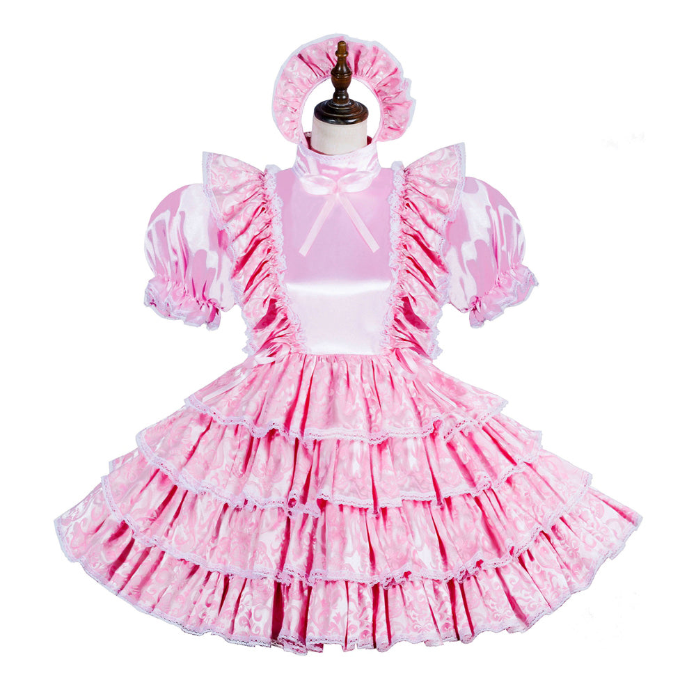 Pink sissy maid dress with ruffles, puff sleeves, and matching headband on mannequin