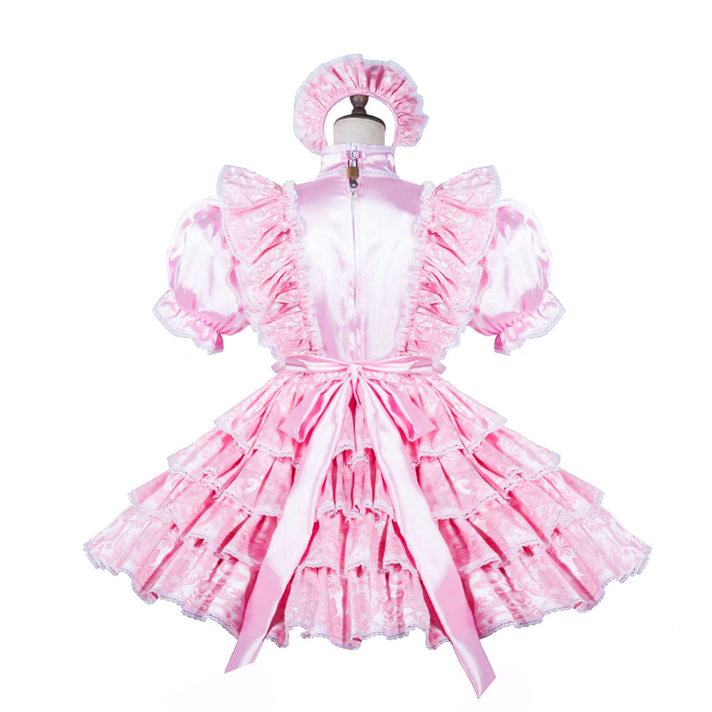 Pink sissy maid dress with ruffles, bow, and matching bonnet, displayed on mannequin
