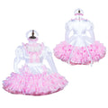 White and pink sissy maid dress with ruffles, puffed sleeves, and matching headpiece on mannequin