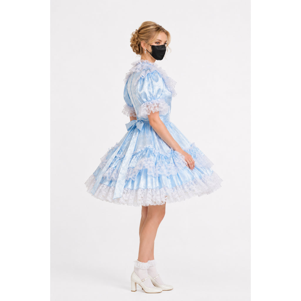 Light blue sissy maid dress with lace ruffles, satin finish, and bow waist, paired with white heels