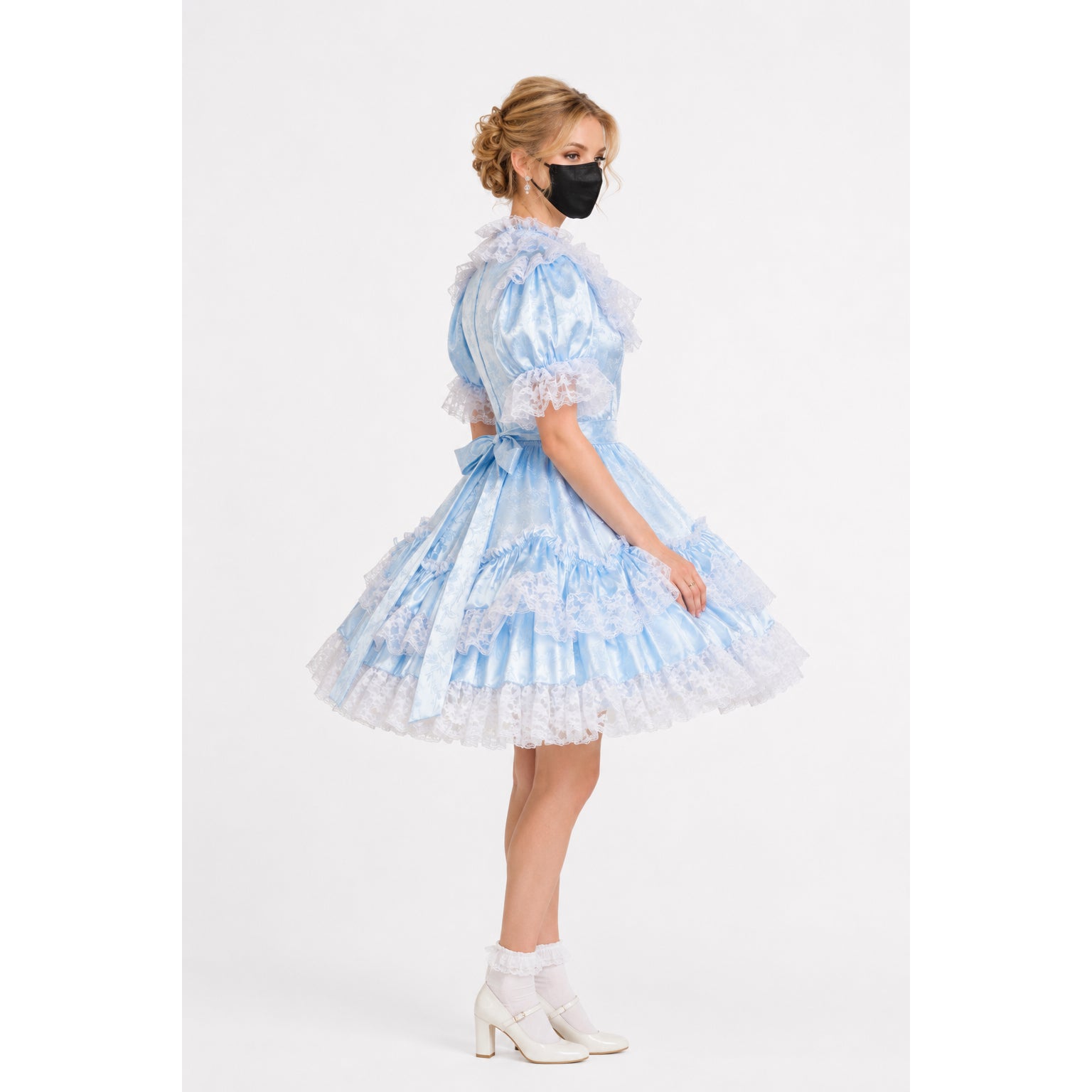 Light blue sissy maid dress with lace ruffles, satin finish, and bow waist, paired with white heels