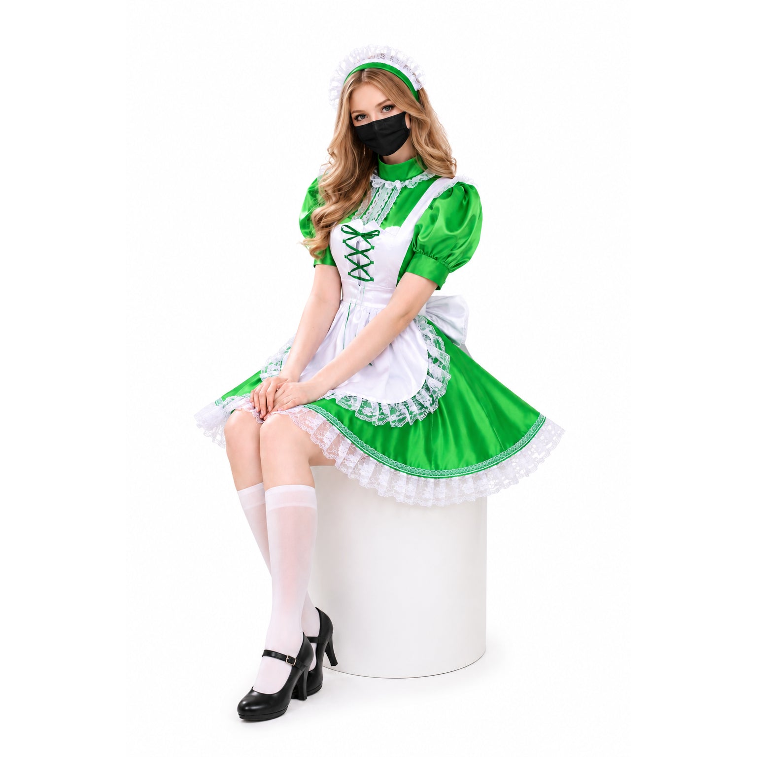 Green and white sissy maid dress with lace trim, apron, and headpiece, worn with white stockings and black heels.