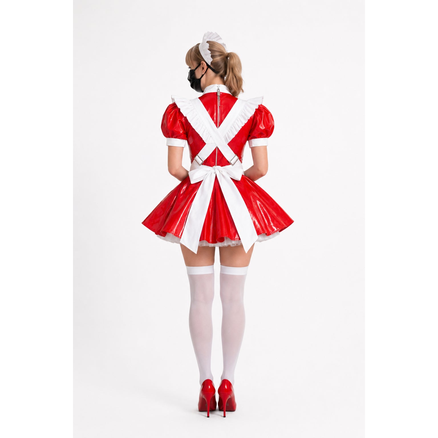Red PVC sissy maid dress with white apron, bow, and ruffles, paired with white stockings and red heels