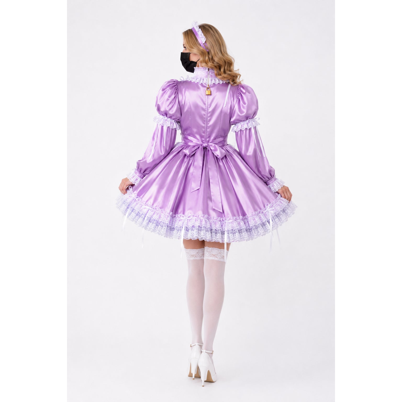 Purple sissy maid dress with lace trim, bow, and lock detail, paired with white stockings and heels