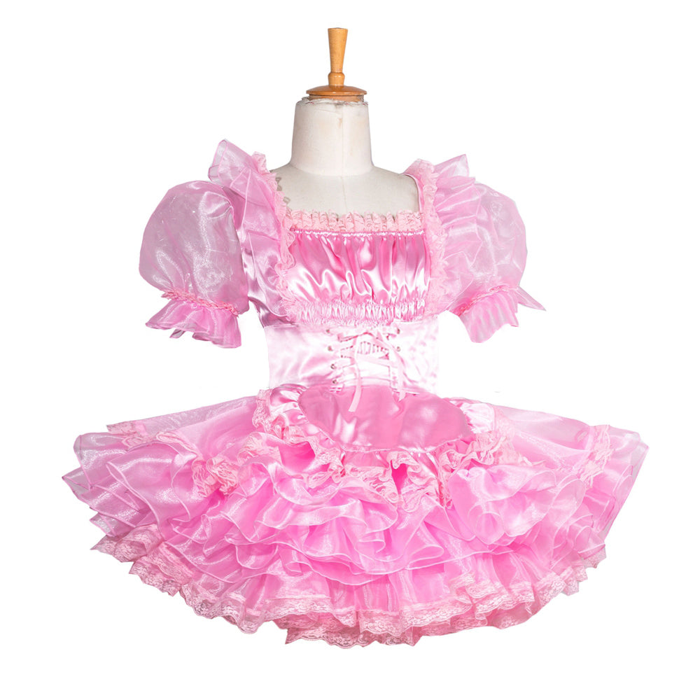Pink sissy maid dress with ruffles, puffed sleeves, and lace trim on mannequin