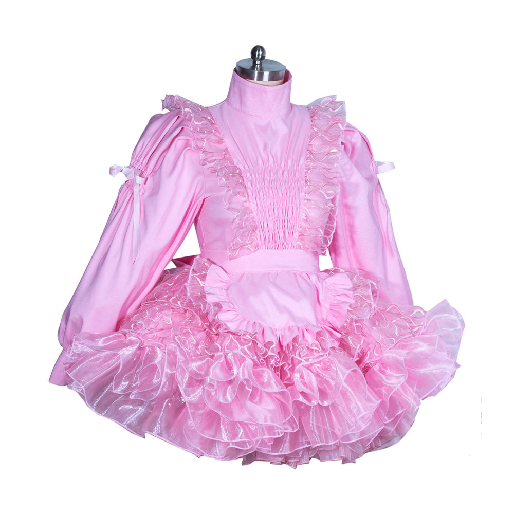 Pink sissy maid dress with ruffles, puffed sleeves, and layered tulle skirt on mannequin