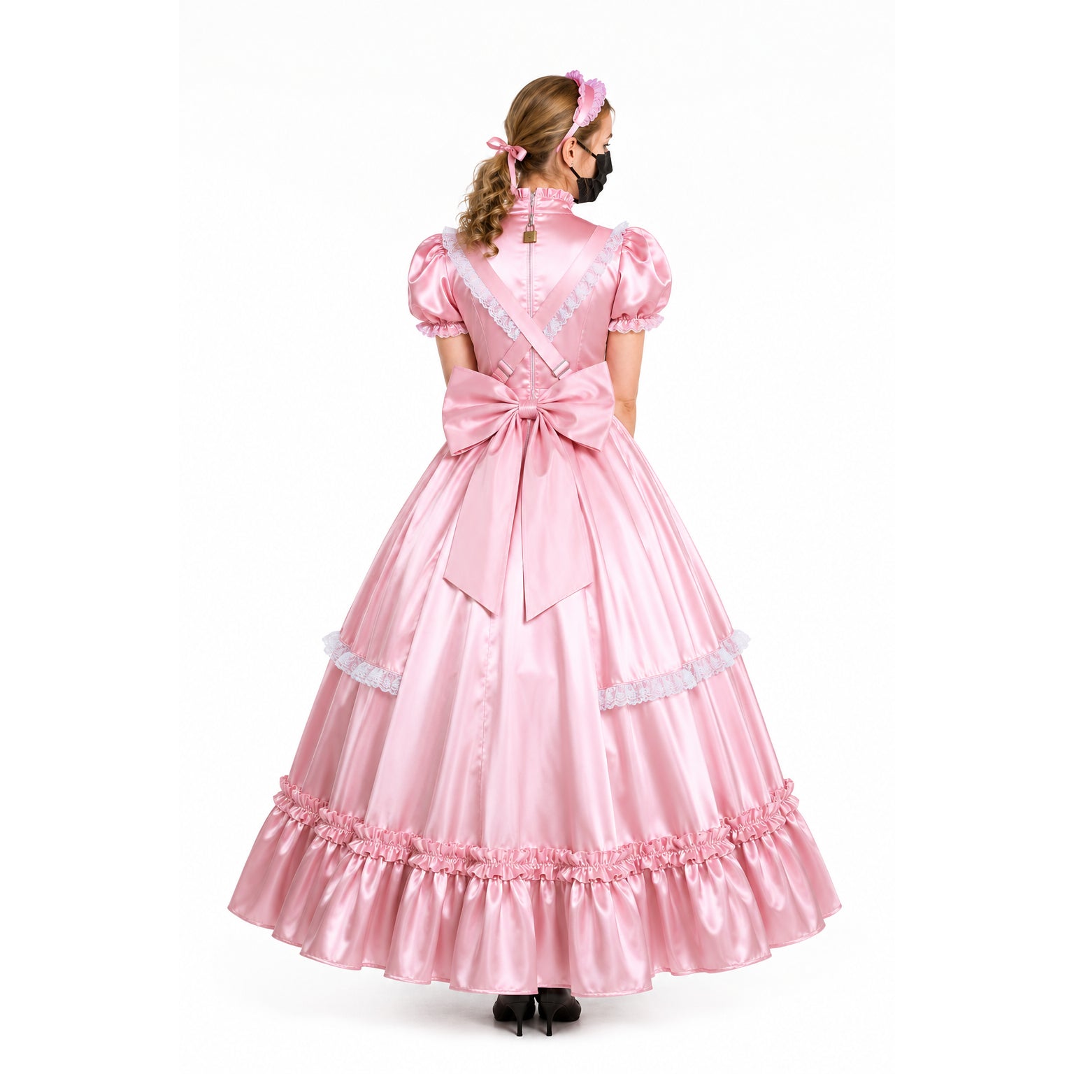 Pink sissy maid dress with lace trim, back bow, and lockable zipper, shown from behind