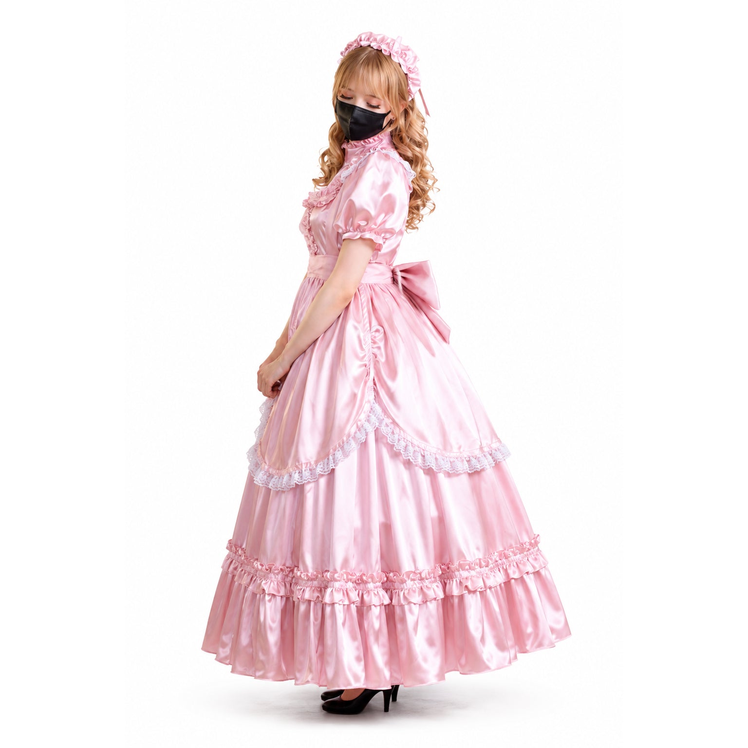 Pink satin sissy maid dress with ruffles, lace trim, and bow, worn with matching headband and black heels
