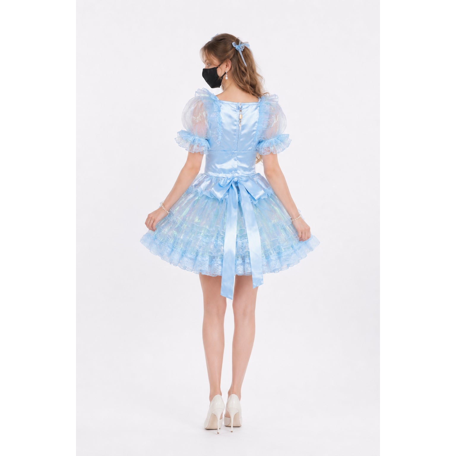 Light blue sissy maid dress with puffy sleeves, lace trim, and satin bow, shown from back