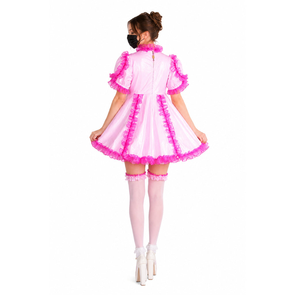 Pink sissy maid dress with ruffles, matching panties, and thigh-high stockings, shown from back view