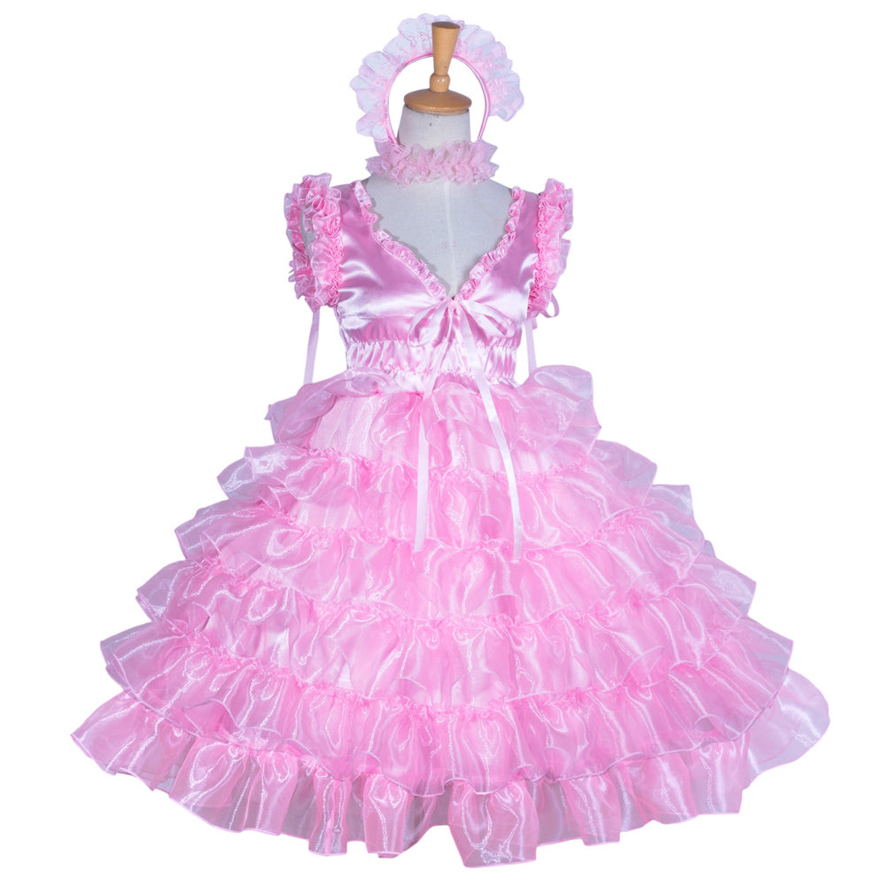 Pink sissy maid dress with ruffles, satin bodice, and matching headband on mannequin