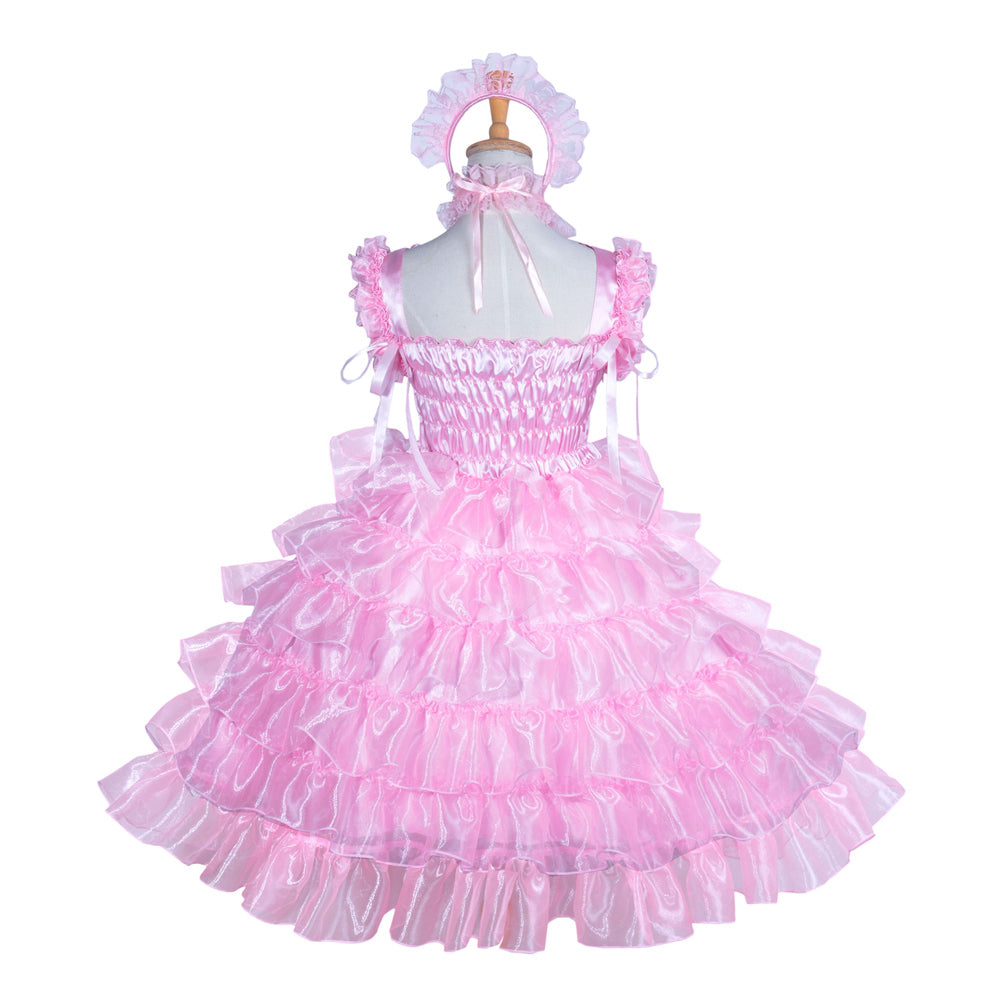 Pink sissy maid dress with ruffled layers, satin bodice, and matching headpiece on mannequin