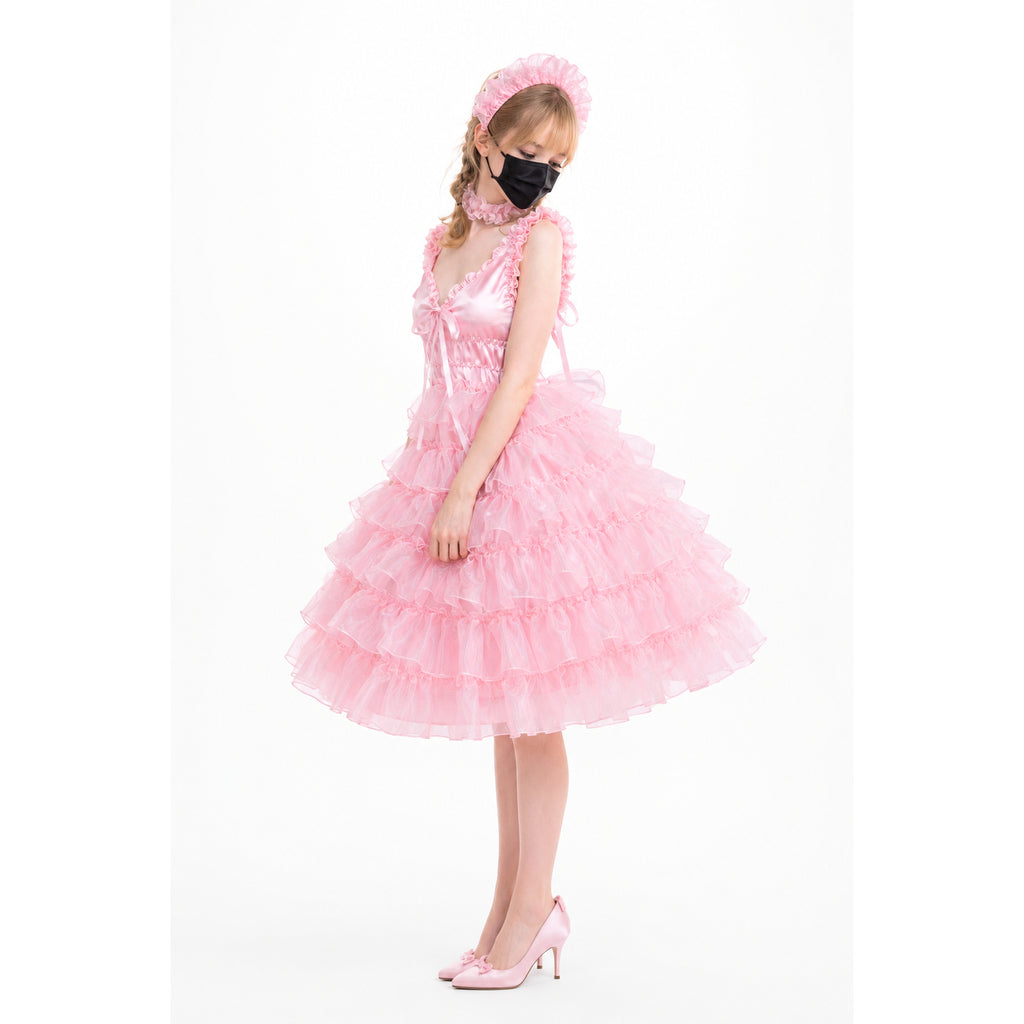 Pink sissy maid dress with ruffled layers, matching headband, and heels on white background
