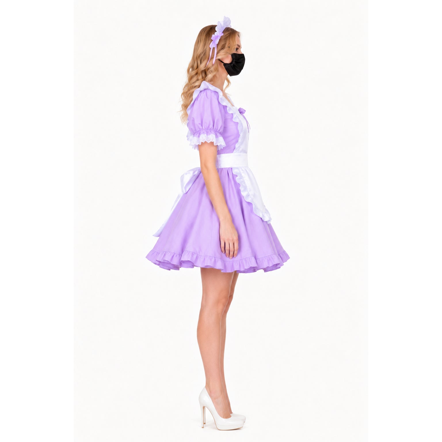 Purple sissy maid dress with white apron, ruffles, and matching headband, styled with white heels.