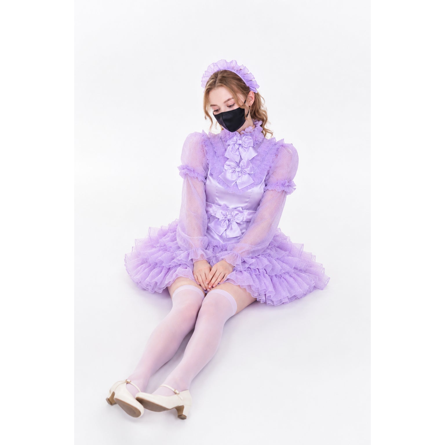 Lavender sissy maid dress with ruffles, bow, and matching headband, worn with thigh-highs and heels.