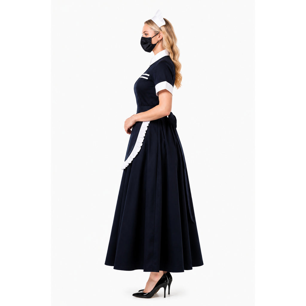 Navy blue sissy maid dress with white apron, collar, and cuffs, paired with black heels and headpiece