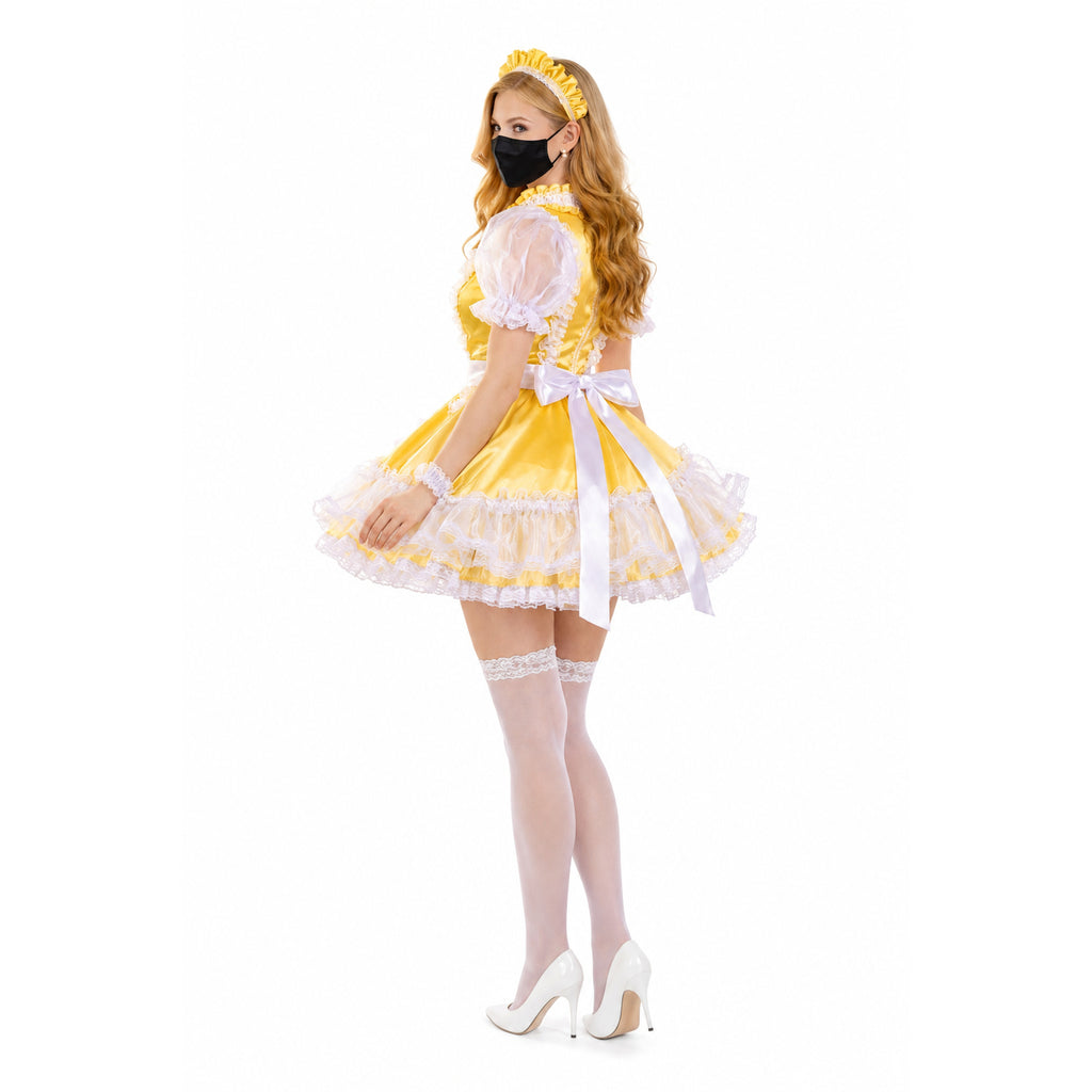 Yellow sissy maid dress with white lace, bow, and matching headband, styled with stockings and heels