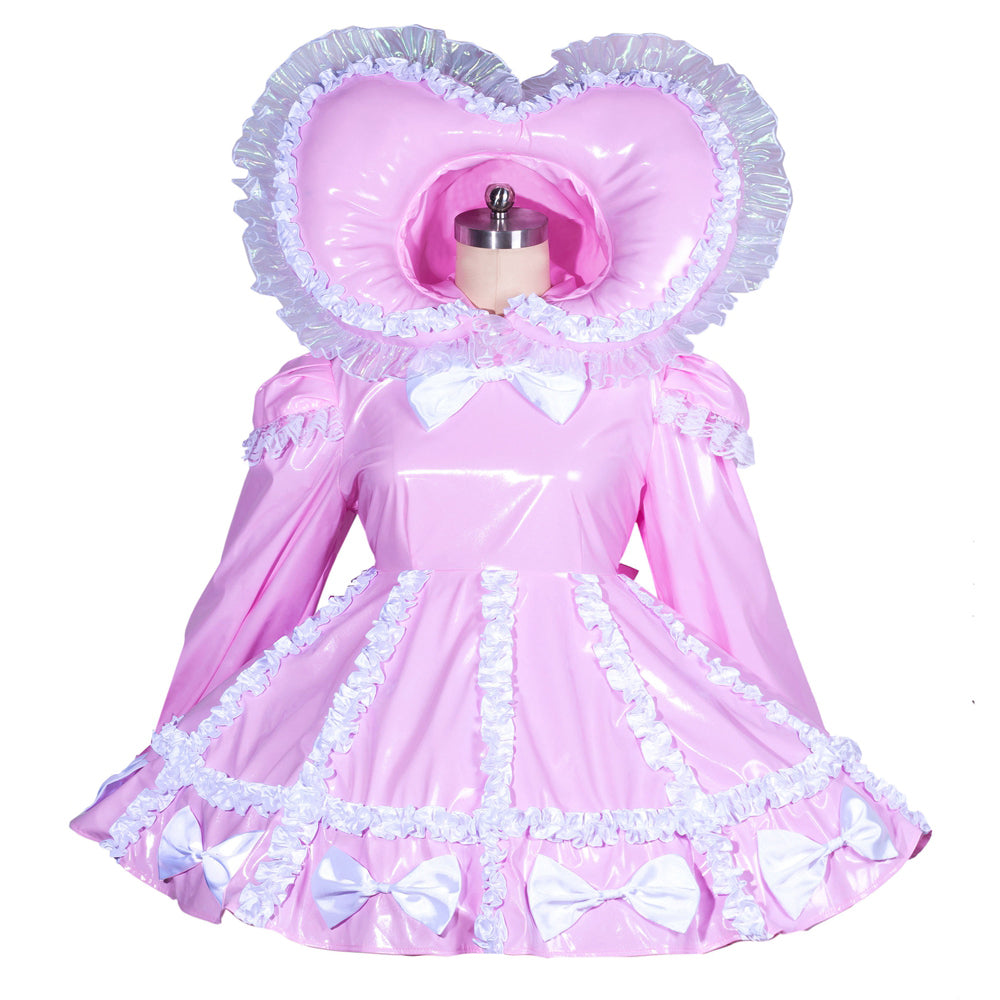 Pink PVC sissy maid dress with heart hood, white ruffles, and bows on mannequin