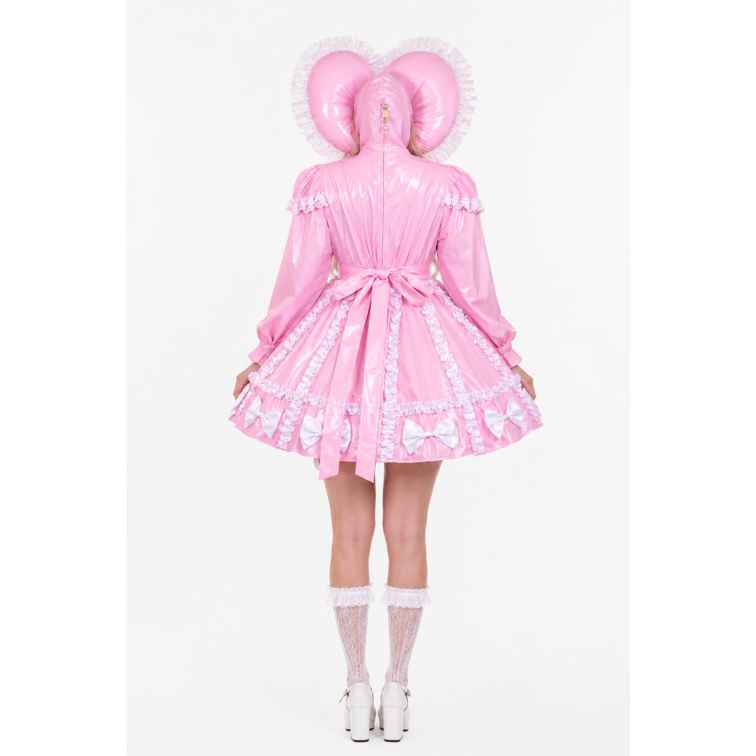 Pink sissy maid dress with ruffles, bows, and hooded ears, paired with lace socks and heels