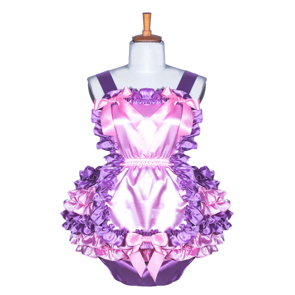 Pink and purple sissy maid dress with ruffles and bows on mannequin