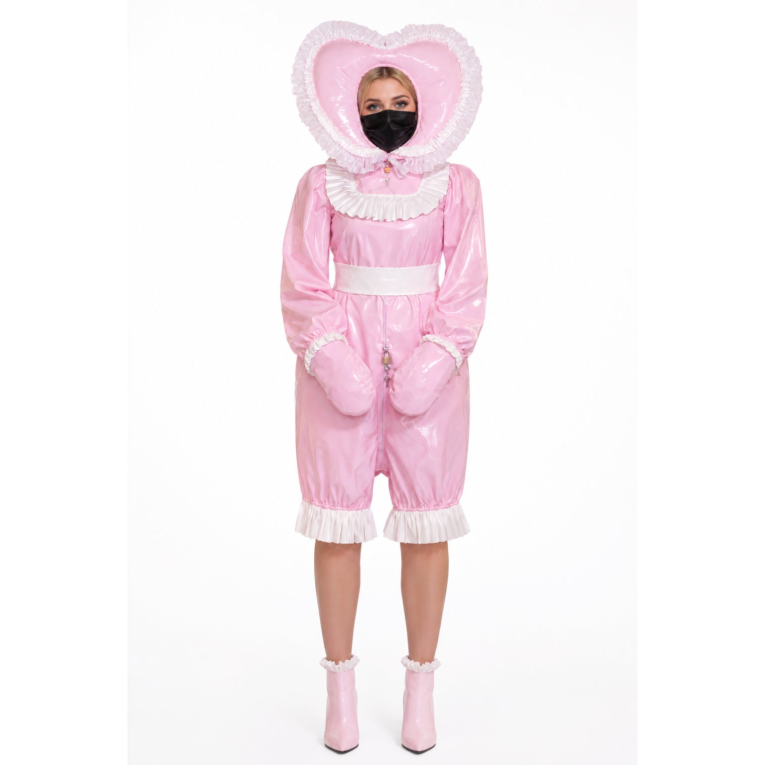 Pink PVC sissy maid dress with heart hood, ruffles, and lockable front, paired with matching boots