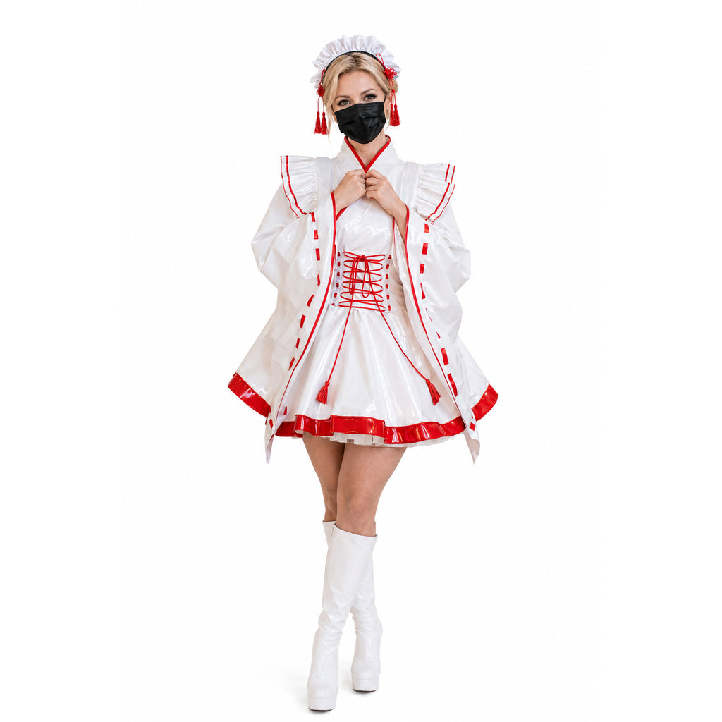 White PVC sissy maid dress with red trim, lace-up front, and matching hat, styled with white boots.