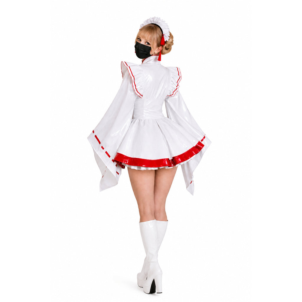 White PVC sissy maid dress with red trim, ruffled sleeves, and high heels, worn with matching headpiece