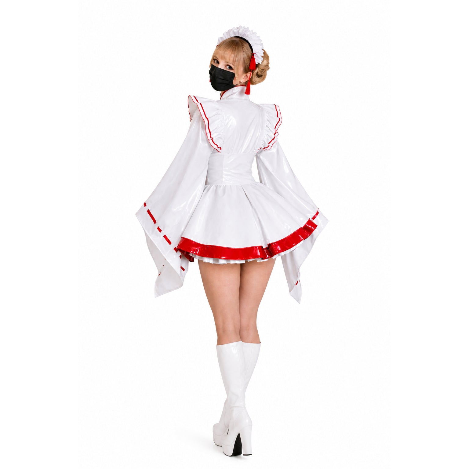 White PVC sissy maid dress with red trim, ruffled sleeves, and high heels, worn with matching headpiece