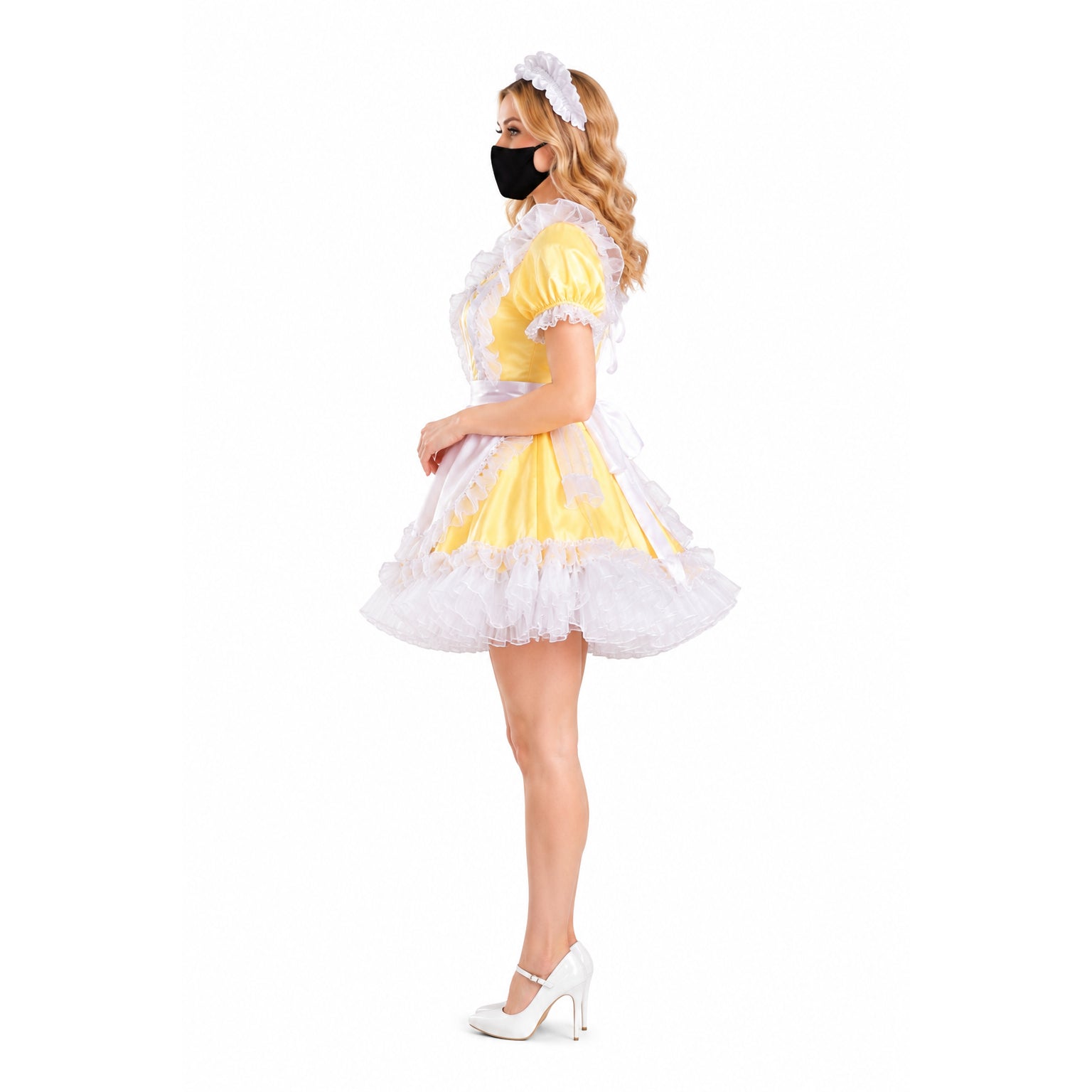 Yellow sissy maid dress with white ruffles, apron, and headpiece, paired with white heels