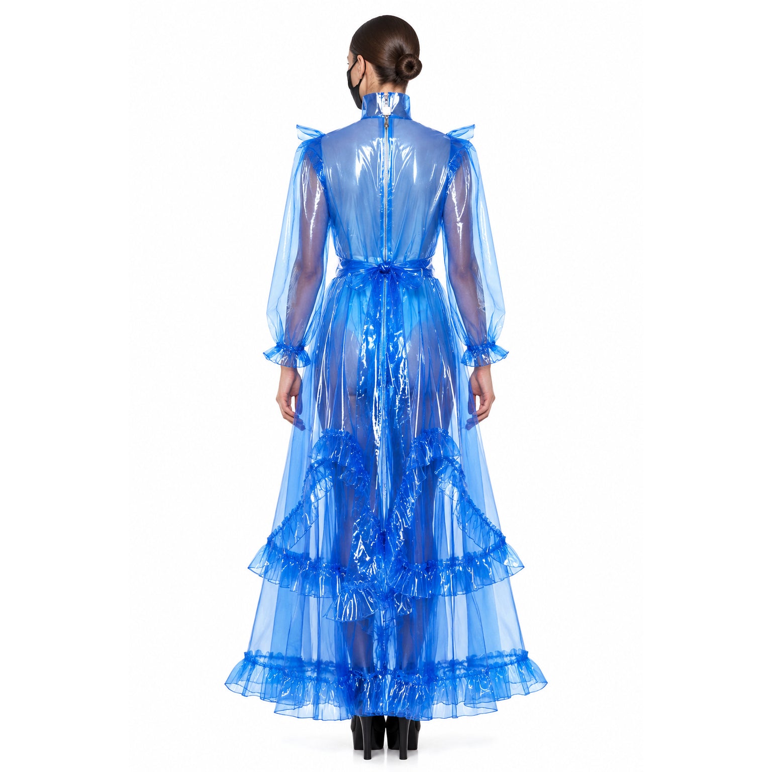 Blue sheer sissy maid dress with ruffles, long sleeves, and back zipper, shown from behind